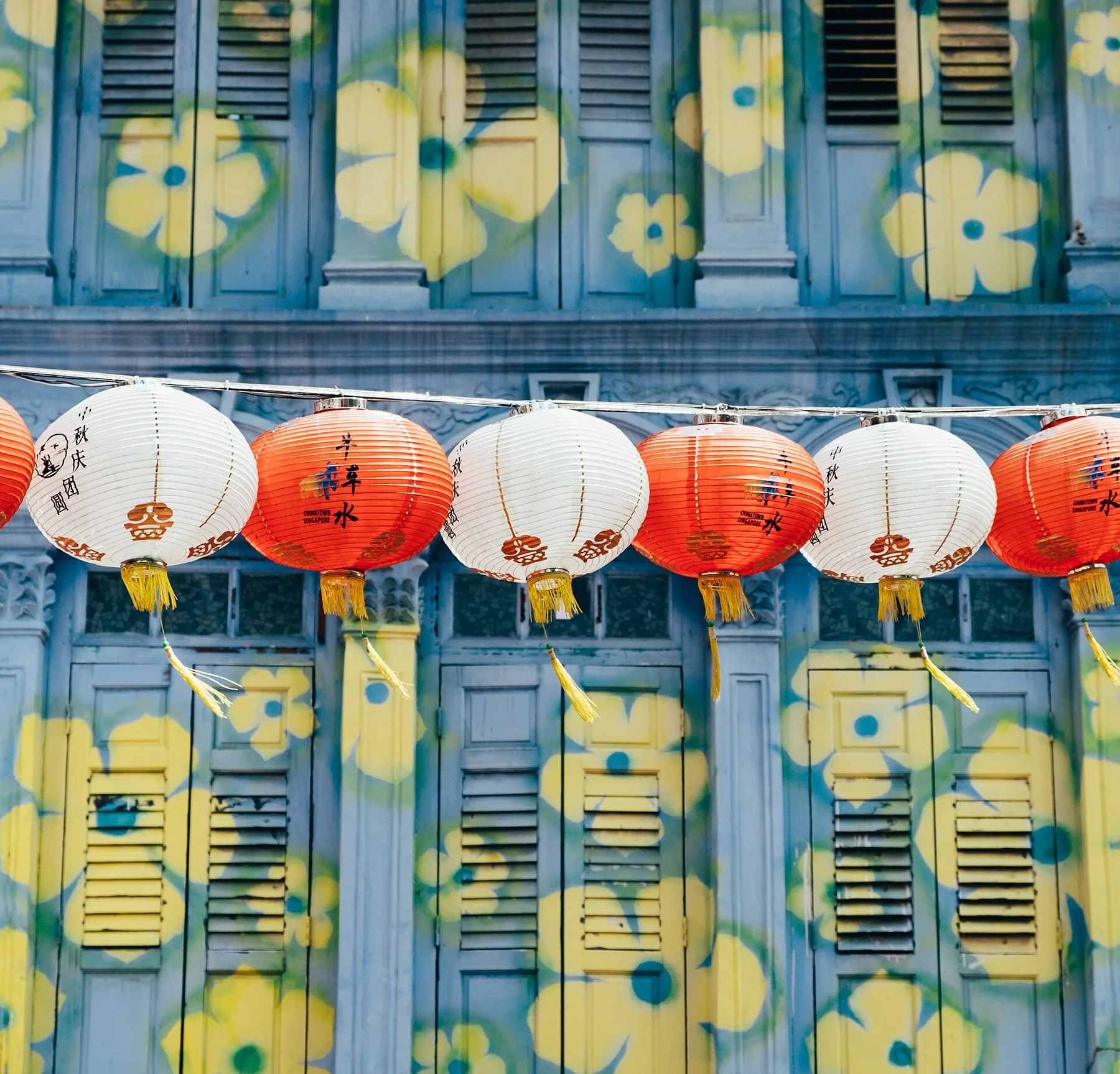 Painted facade with red lanterns in Singapore