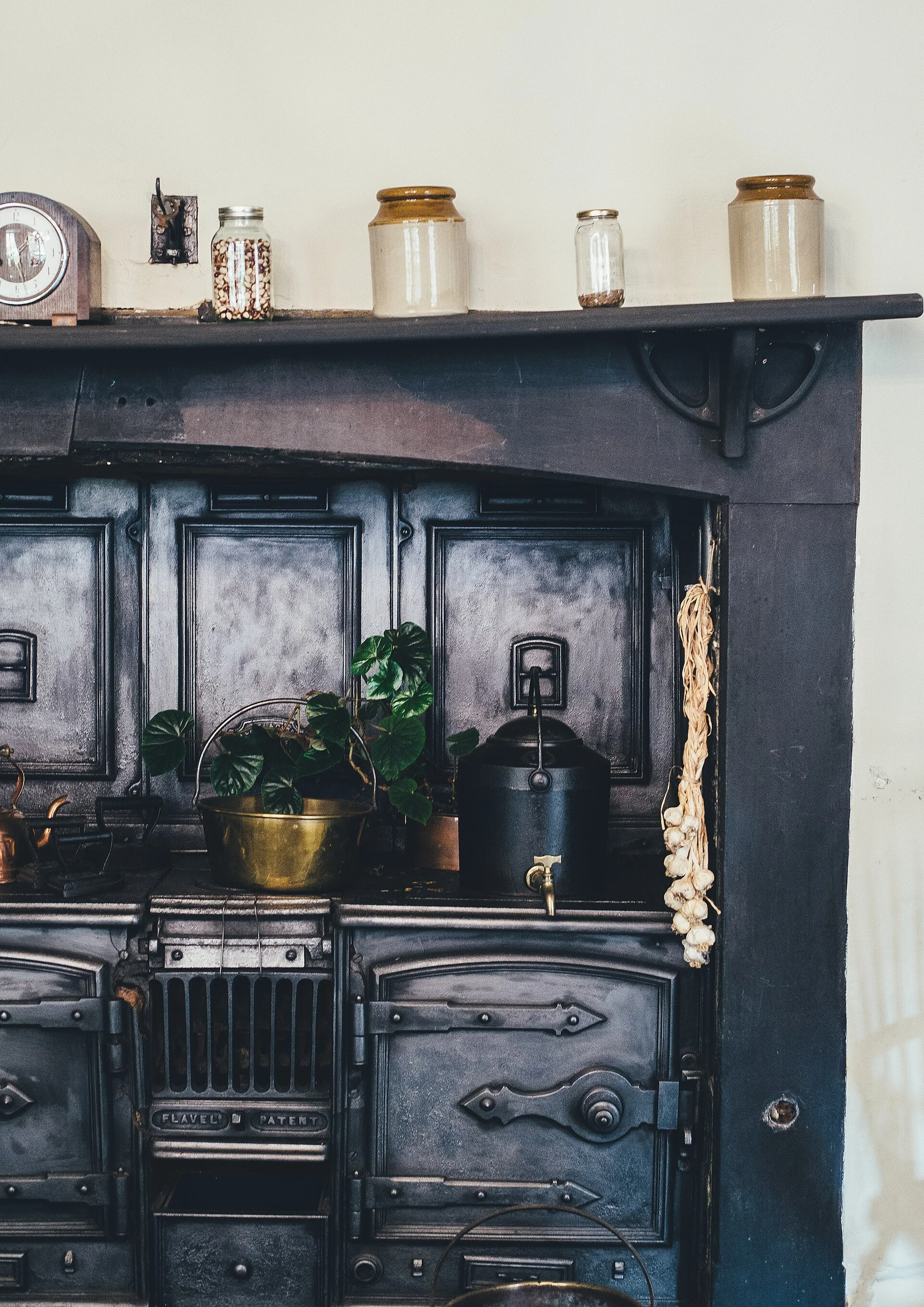 Dark antique furniture and collected objects inside Chawton House Library
